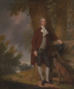 En herre og hunden hans i et landskap